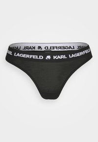Svart trosa i spets med mjukt, genomskinligt material och bred midjeband med vit "Karl Lagerfeld" märkning.