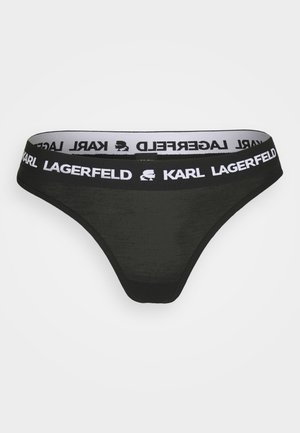 Sort trusse lavet af blødt, gennemsigtigt materiale med en bred talje med hvid "Karl Lagerfeld" branding.