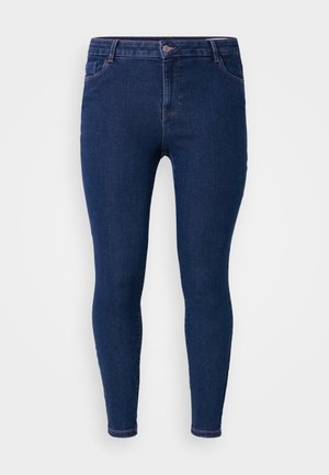 Ciemnoniebieskie wąskie dżinsy wykonane z denimu, z klasycznym pięciopocketowym wzorem, standardowym paskiem w talii oraz slim-fit sylwetką.