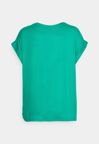 T-shirt vert uni à manches courtes avec revers roulés, vu de dos sur fond blanc.