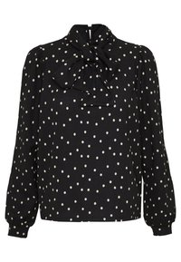 Blusa nera con pois bianchi, dotata di un colletto alto e dettaglio a fiocco. Maniche lunghe con polsini arricciati. Tessuto leggero.