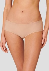 Nude-colored hipster briefs made from smooth fabric, featuring a seamless waistband and a minimalist design.