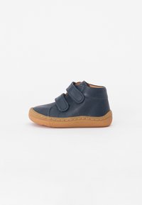 Navy leather high-top shoes with two Velcro straps, stitched detailing, and a light brown rubber sole. Smooth texture, minimalist design.
