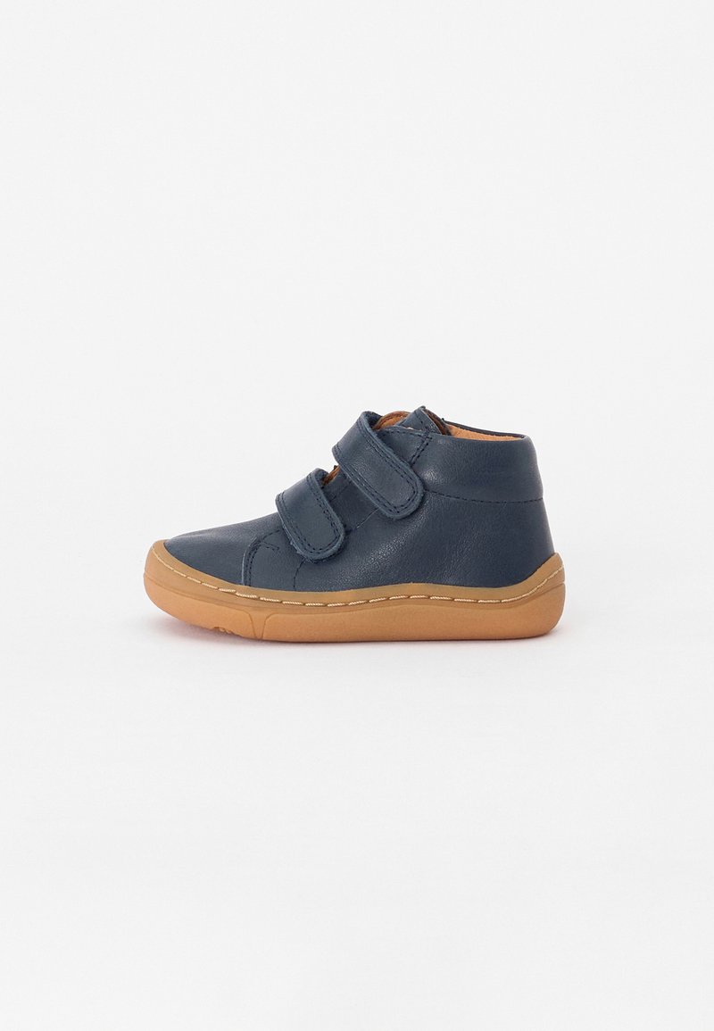 Navy leather high-top shoes with two Velcro straps, stitched detailing, and a light brown rubber sole. Smooth texture, minimalist design.