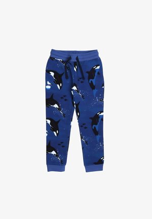 Blue sweatpants featuring an orca pattern, black and white illustrations, with splashes of water and small fish accents. Drawstring waistband.