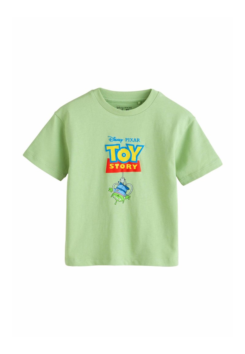 Hellgrünes T-Shirt mit kurzen Ärmeln, Toy Story-Logo und einer Grafik eines grünen Alien-Charakters, der in einem Greifautomaten gefangen ist, auf der Vorderseite.