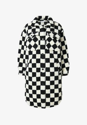Rutet frakke lavet af fluffy sort og hvidt stof, med to brystlommer, knaplukning og en rundet kant for en afslappet pasform.