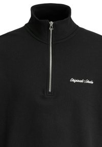 Black pullover sweatshirt with a stand-up collar and half-zip closure. Features a white embroidered logo on the left chest area.