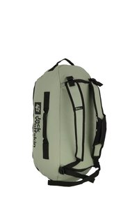 Green fabric duffel bag with black straps, featuring a top handle and logo. Smooth texture, cylindrical shape, and adjustable shoulder straps.