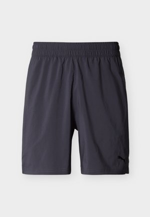 Crne sportske kratke hlače s elastičnim pojasom i logom marke Puma na donjem lijevom nožnom dijelu, prikazane na bijeloj pozadini.