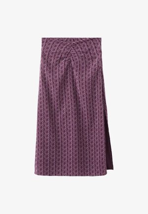 Jupe midi violette à motif floral subtil, avec plis devant et fente latérale, fabriquée en tissu texturé.