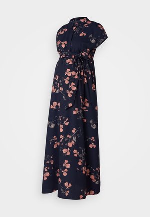 Floral zwangerschapsjurk van marineblauwe stof, met korte mouwen, een hoge halslijn en een strik in de taille. Versierd met roze en donkergroene bloemen.