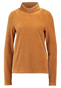 Turtleneck langærmet bluse i ribbet, brændt orange kordfløjl med en afslappet pasform og struktureret overflade. Blødt, behageligt materiale.