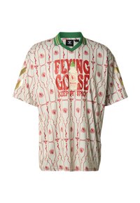 Chemise crème à manches courtes avec un motif de bouteilles de sauce piquante rouge et verte, col vert et accents dorés. Inscription devant : "FLYING GOOSE".