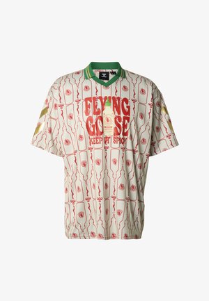 Rövid ujjú, krémszínű ing piros és zöld csípős szósz üveg mintával, zöld gallérral és arany díszítéssel. Az elején "FLYING GOOSE" felirat található.