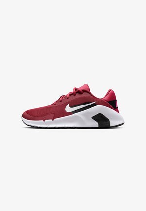 Chaussure de running Nike rouge avec une semelle blanche et des accents noirs, avec le logo Nike blanc sur le côté, vue du côté extérieur.