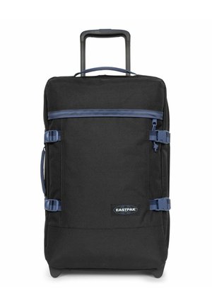 Valise à roulettes noire en tissu résistant, dotée d'une poignée supérieure, d'accents bleus, d'une poche zippée à l'avant et de sangles de compression.