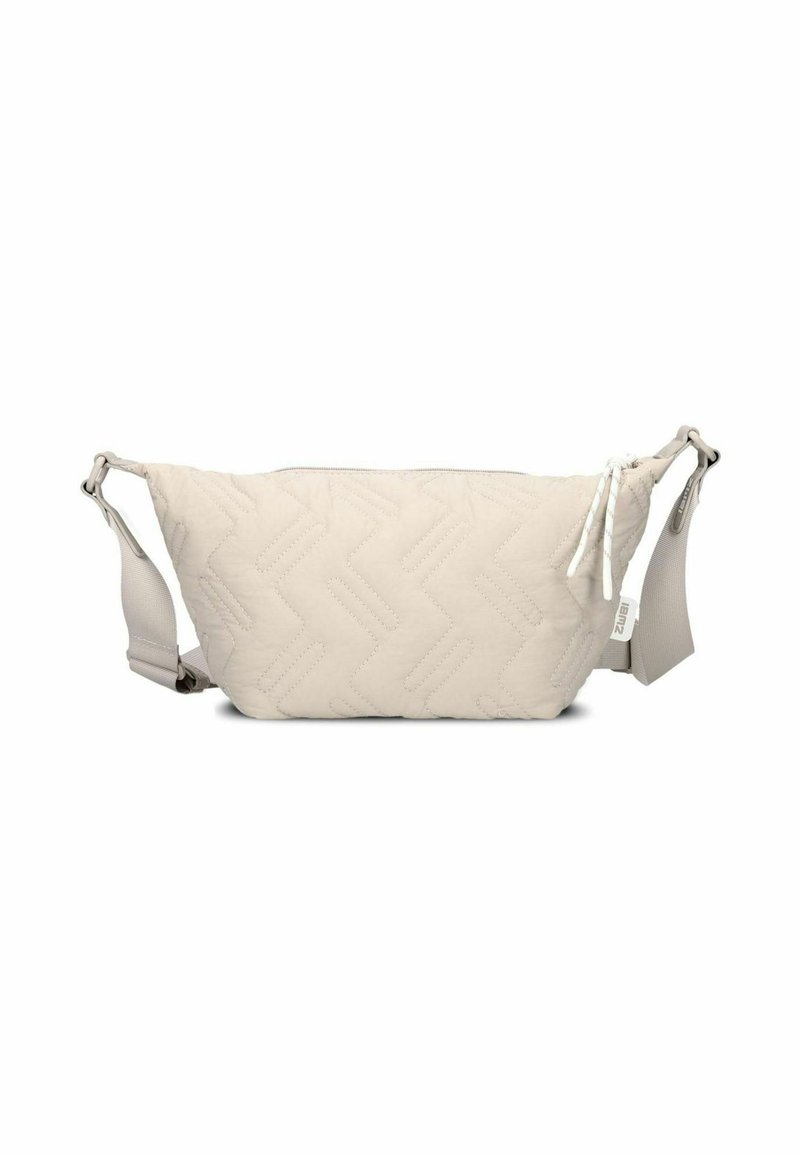 Gepolsterte beige Bauchtasche mit Zickzackmuster, ausgestattet mit einem Reißverschluss und einem verstellbaren Riemen, aus weichem Material gefertigt.