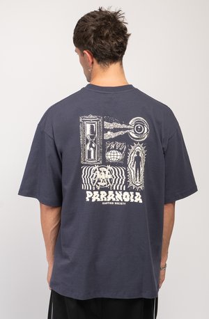 Navy blue oversized t-shirt made of cotton, featuring a large white graphic design on the back, including text "PARANOIA" and various illustrations.