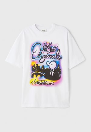 White cotton T-shirt featuring front graphic with colorful text, a cartoon figure in a suit, a bridge, and a city skyline.