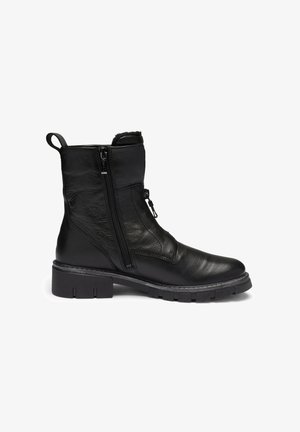 Black leather ankle boot with chunky sole, side zipper, pull tab at heel, and padded collar.