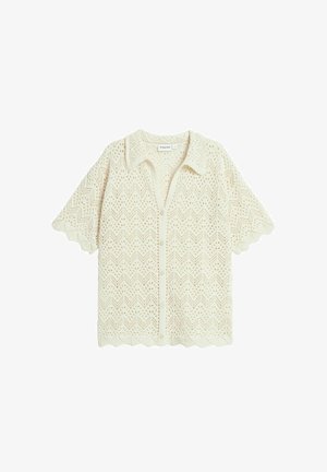 Cremfarbener Häkel-Cardigan mit Chevron-Muster, kurzen Ärmeln, Kragen und gewelltem Saum sowie Knopfverschluss.