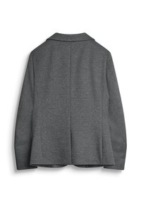 Blazer gris en tissu texturé, avec un col classique, des manches longues et une fente au dos pour faciliter le mouvement.