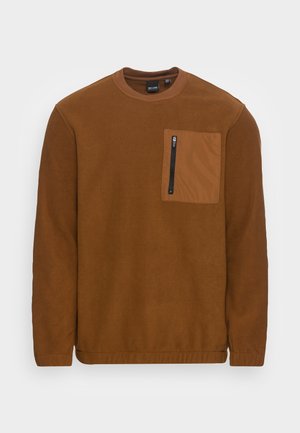 Braunes Fleecepullover mit rundem Ausschnitt und langen Ärmeln. Es verfügt über eine quadratische Fronttasche aus kontrastierendem Material mit einem schwarzen Reißverschluss.