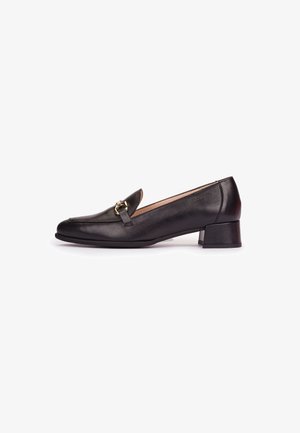 Black leather low-heeled loafer with gold metal buckle detail, rounded toe, and smooth finish, shown from the inner side.