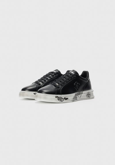 Black leather sneakers with black laces and white soles featuring black graphic designs and a raised logo on the side.