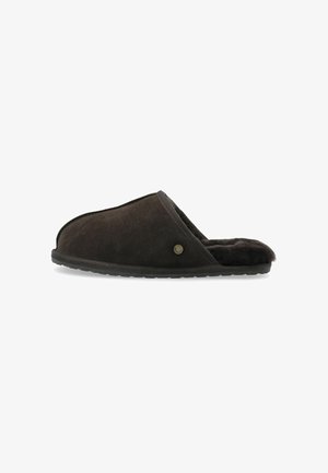 Dark brown suede slipper with a soft, plush interior. Features a rounded open toe and a textured rubber sole. Accented by a small metal logo.