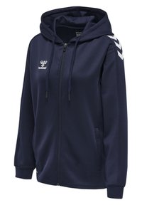 Felpa con zip blu marina, con superficie testurizzata, cordini, tasche laterali e accenti bianchi a forma di chevron sulle spalle. Caratterizzata da un logo sul petto.