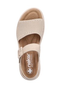 Beige slide sandal with a knitted upper and single strap. Cushioned, perforated insole for breathability. Features a side buckle.