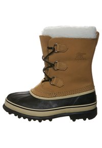 Beige Leder-Schneestiefel mit weißem Fellfutter, schwarzem Gummibereich unten, drei Metallösen und einer strukturierten Sohle für besseren Halt.