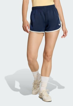 Granatowe spodenki do biegania z białym obszyciem, wyposażone w elastyczny pas i małe logo po lewej stronie. Gładki, lekki materiał.
