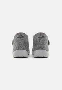 Gray felt slippers with a soft texture, rounded backs, velcro straps, and rubber soles featuring a speckled design.