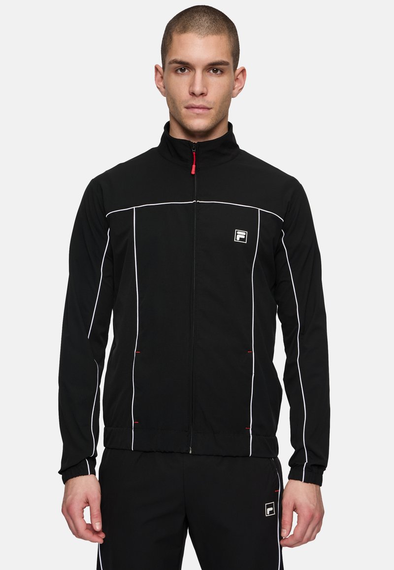 Zwarte zip-up jas met witte accentlijnen en logo op de linkerkant van de borst, met een opstaande kraag en elastische manchetten.