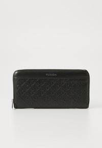 Black zippered wallet with quilted design featuring embossed logos. Smooth leather finish, rectangular shape, and silver-tone hardware detail.