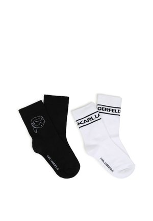 Deux paires de chaussettes Karl Lagerfeld, une noire avec un logo blanc du visage de Karl, une blanche avec le texte "KARL LAGERFELD" en noir près du haut.