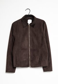 Brown suede jacket with a collared neckline and zipper closure. Features seam detailing and a straight cut. Hangs on a black hook.