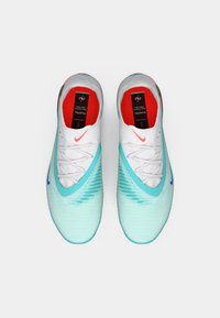 Nike Phantom soccer shoes with a white upper, turquoise gradient, textured detailing, and a red interior. Features blue branding and laces.
