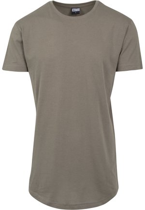 Olivgrön t-shirt i mjuk bomull, med rund halsringning och korta ärmar, samt en längre, böjd nederkant för en avslappnad passform.