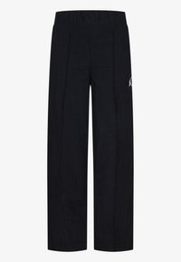 Pantaloni neri a gamba larga realizzati in tessuto testurizzato, dotati di una fascia elastica in vita e di un piccolo logo sul lato sinistro anteriore.