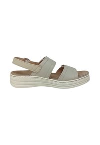 Sandal in pelle beige chiaro con due ampie cinghie e una fibbia regolabile sul retro. Suola spessa bianca con una finitura testurizzata.