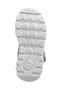 Suela de zapato de goma blanca con patrón de agarre texturizado que presenta lugs triangulares y un área elevada en el talón. Tamaño marcado como "25."