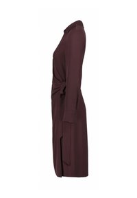 Bordeauxfarbene Hemdkleid mit gebundenem Taillengürtel, langen Ärmeln und Kragen. Glatter Stoff und gerader Schnitt mit seitlichen Schlitzöffnungen für mehr Bewegungsfreiheit.