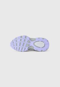 Sole of a sneaker with purple and gray tread pattern, featuring Lacoste brand name and logo in the center.