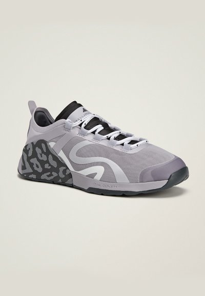 Light gray athletic shoe with a black and gray patterned sole, featuring mesh fabric and a cushioned collar. Lace-up design with subtle branding.