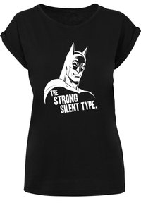 Black cotton t-shirt with rolled sleeves featuring a graphic of a character and text “THE STRONG SILENT TYPE” in white.