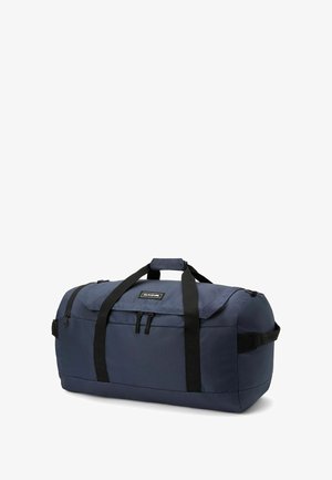 Borsa duffle della marina realizzata in tessuto resistente con cinturini neri, tasche con zip e forma arrotondata. Presenta una maniglia superiore e maniglie laterali.